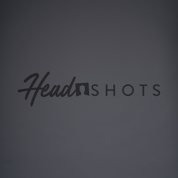 charcoal grey background professional headshot