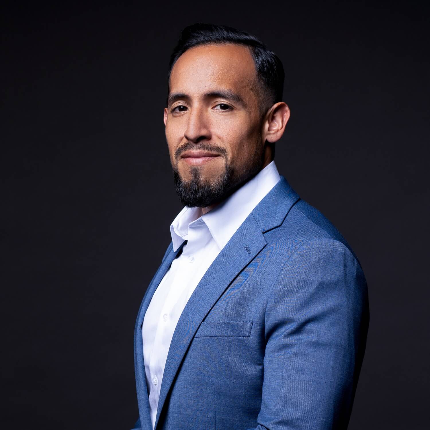 CEO headshot photography example in studio on black with suit
