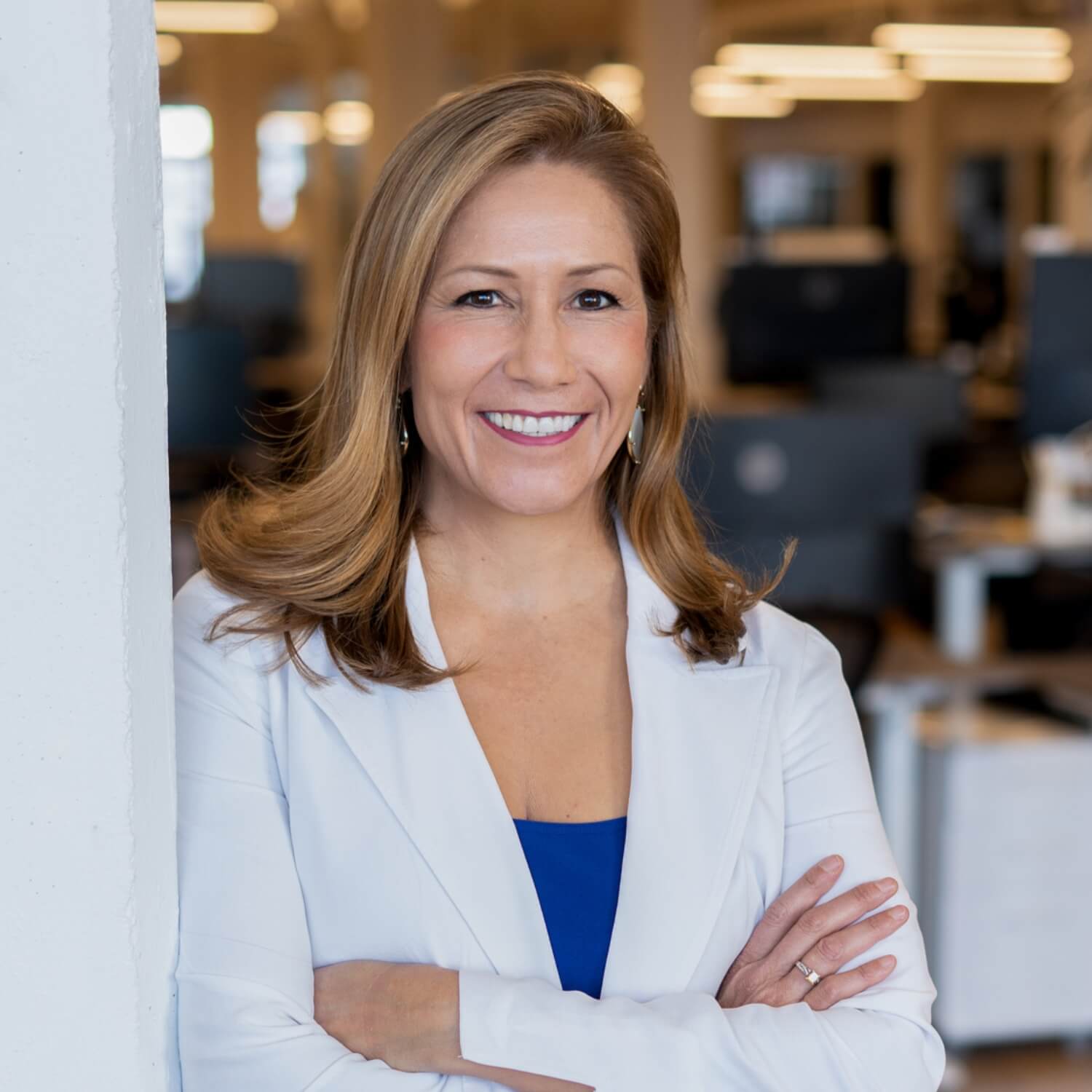 CEO headshot photography at office building in white coat