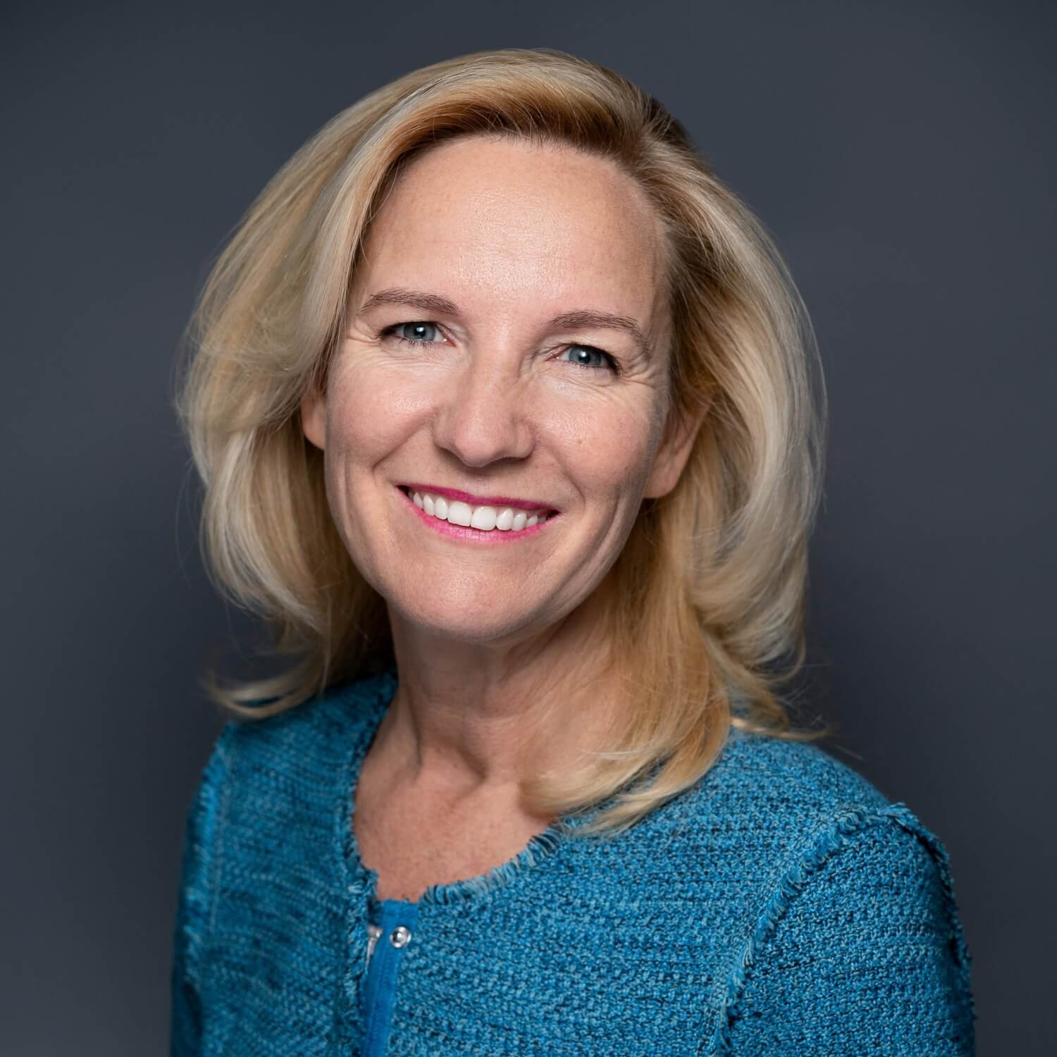 corporate headshot photography example on charcoal background