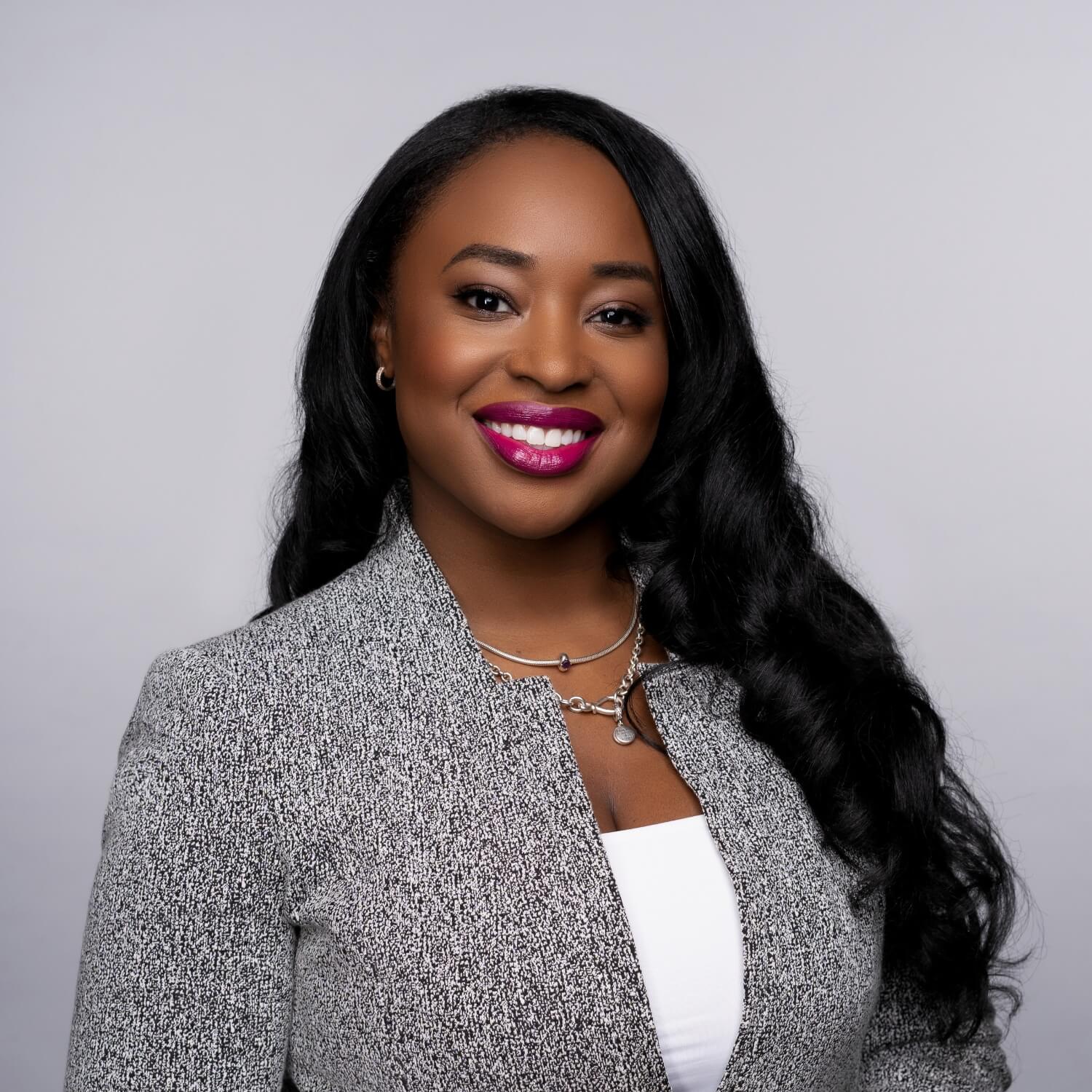 corporate headshot on gray studio background with beauty editing