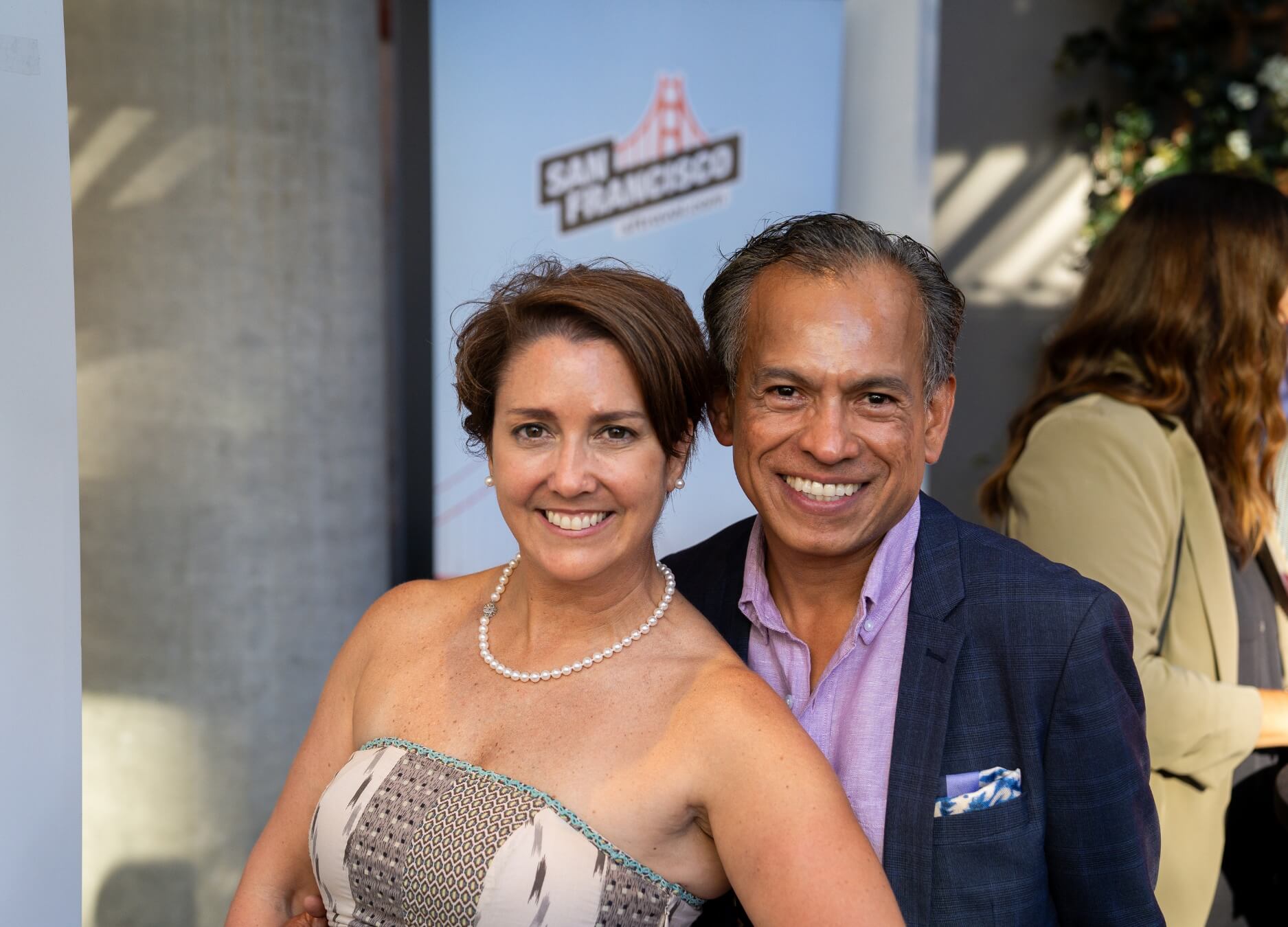 people having fun at party with logo in background