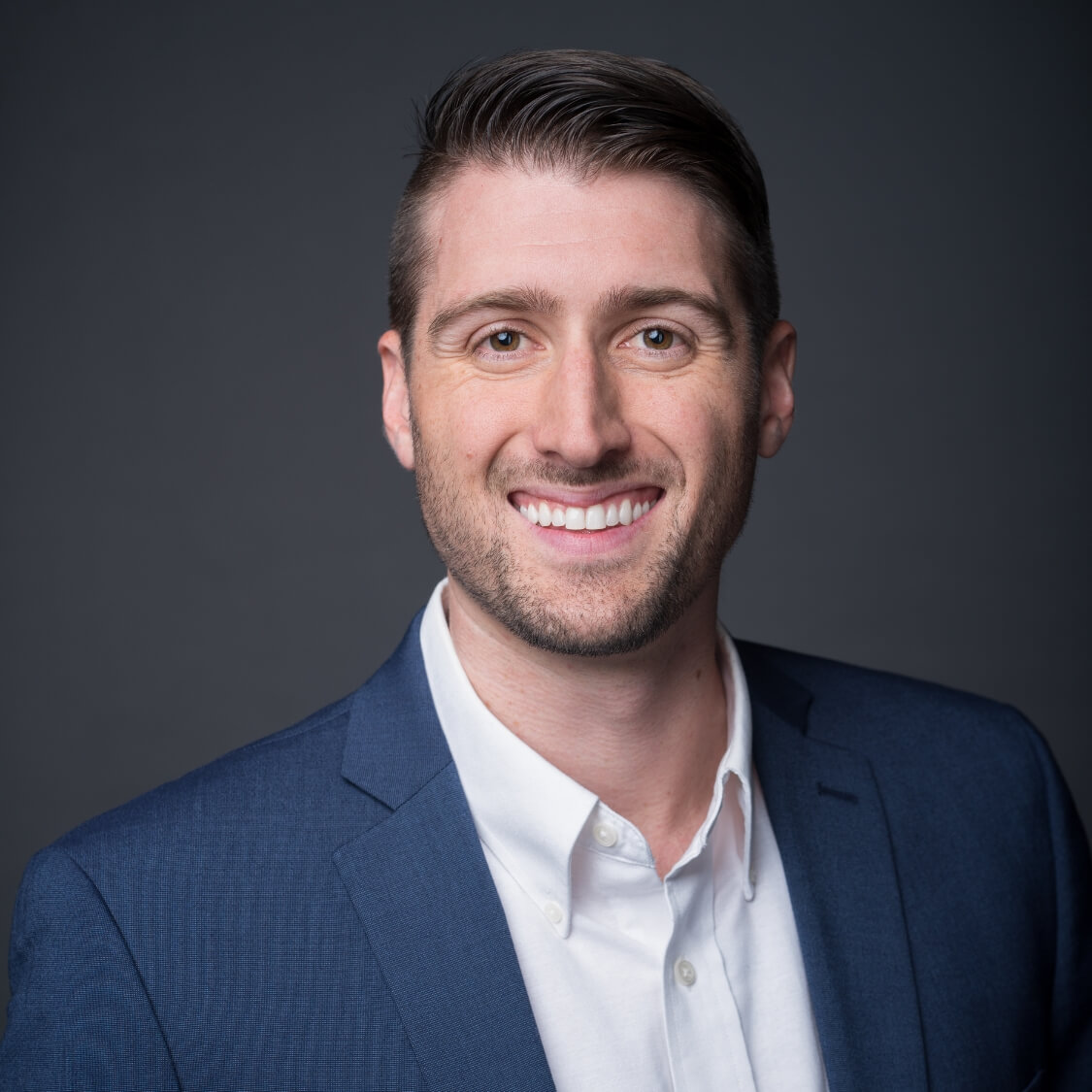 charcoal grey background professional headshot